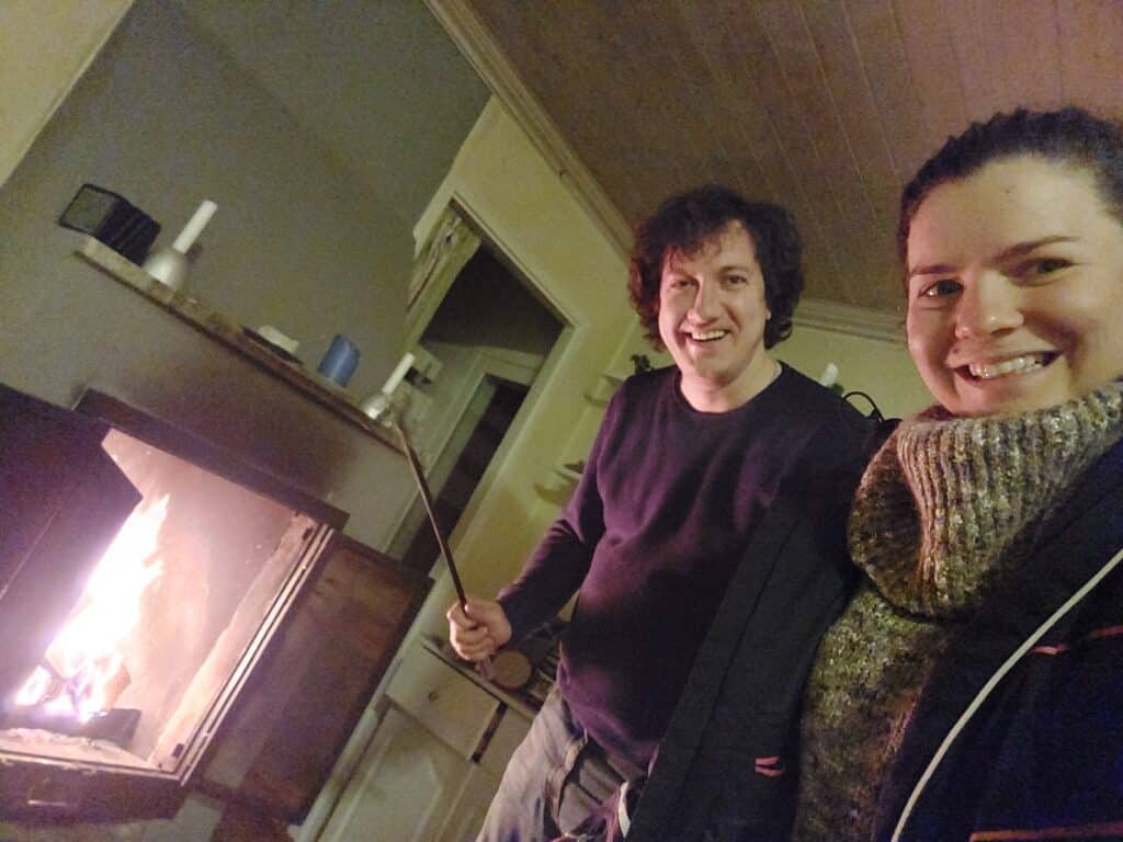 The fire crackling in the fireplace